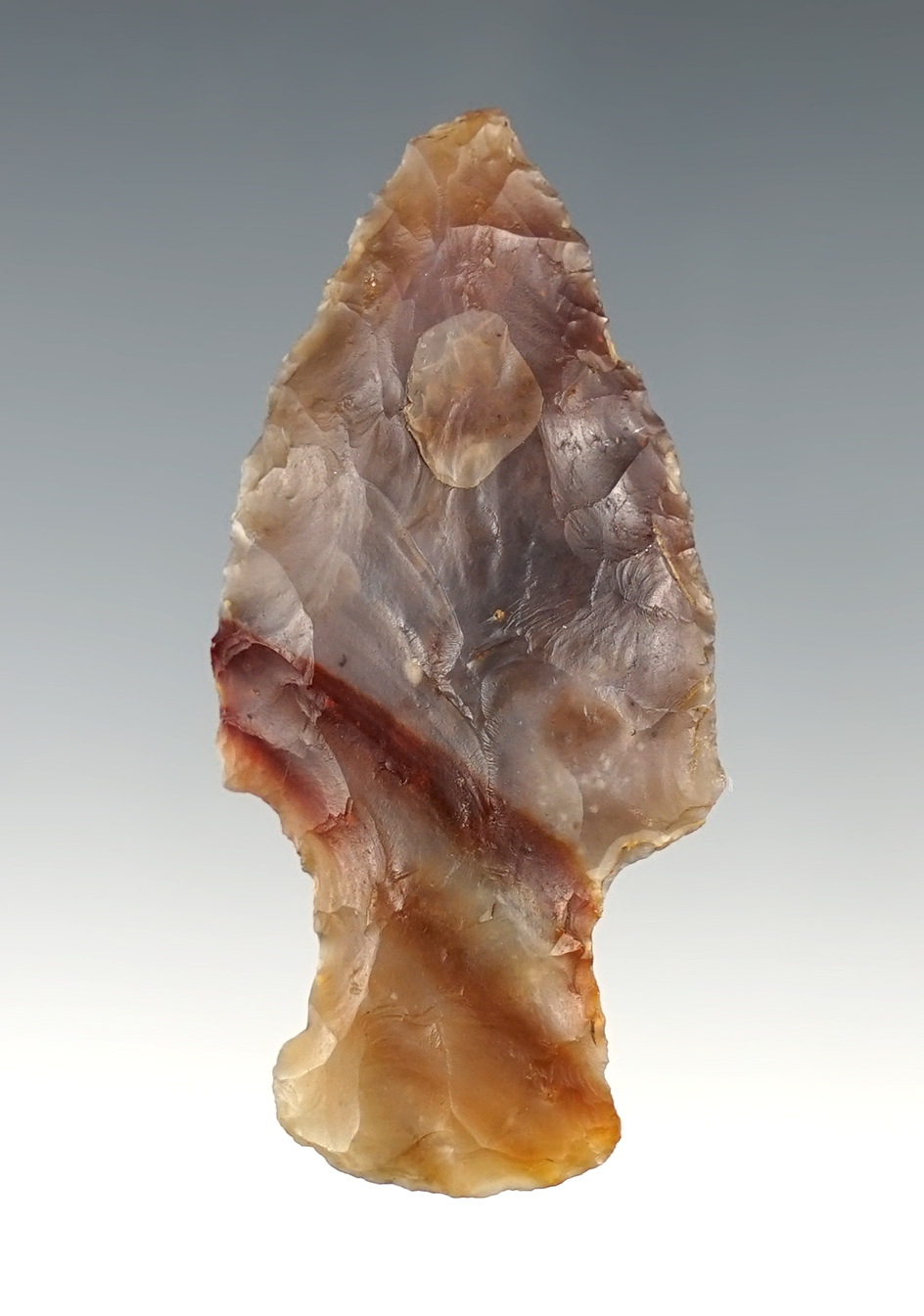 2 1/4"  High Grade Flint Ridge Hopewell with a nice amber streak through the Flint. Found in Ohio.