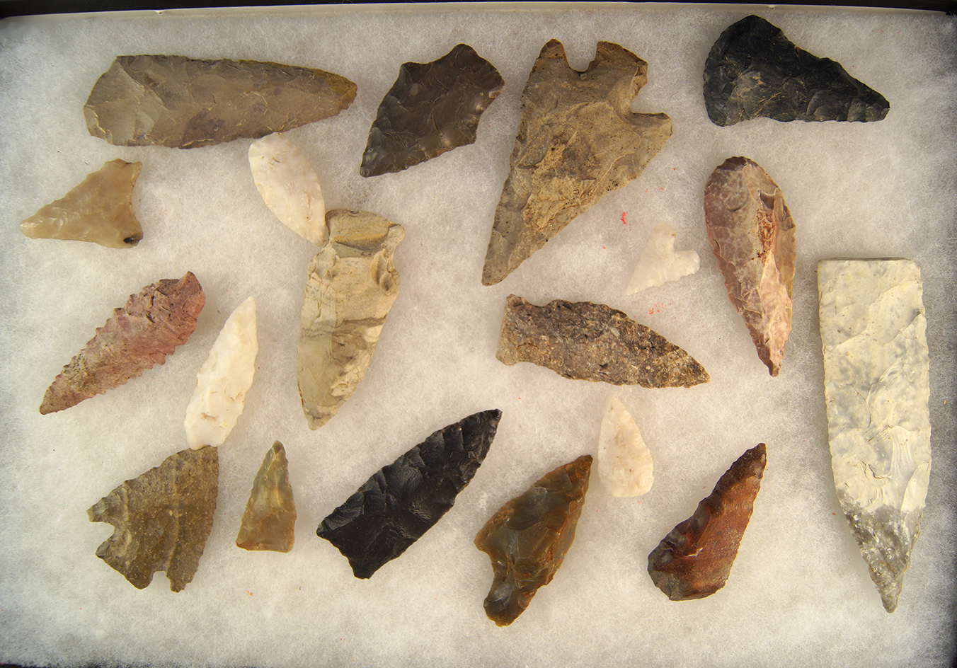 Group of assorted artifacts from across the United States, a few are damaged and one is broken.