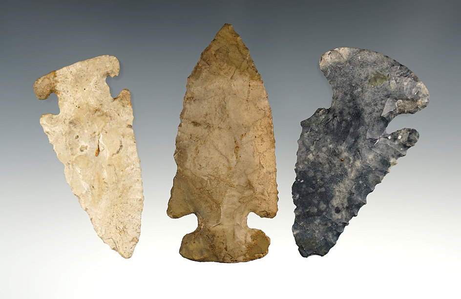 Three Archaic Points, two E-notches, one Dog Leg Bevel. All restored or broken barbs.