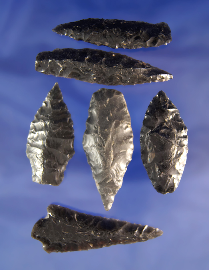 Group of six assorted Obsidian arrowheads, largest is 2 5/16". Found in Oregon and California.