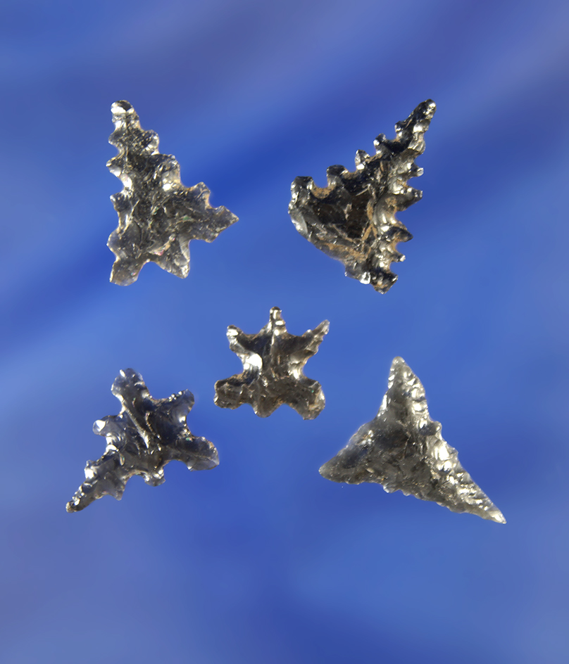 Quality set of uniquely styled heavily serrated obsidian arrowheads, largest is 5/8".