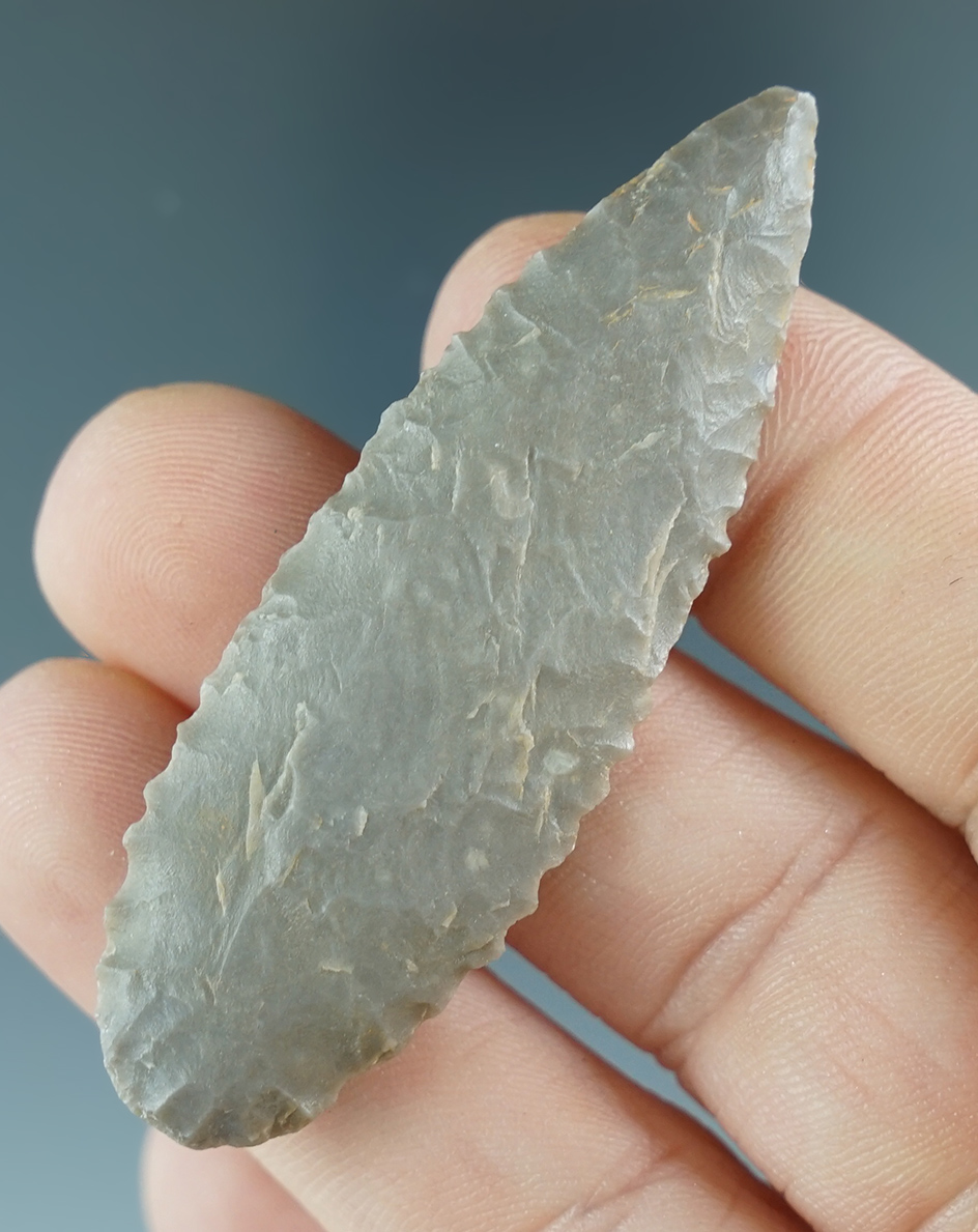 2 5/16" nicely serrated leaf point found in Texas. Ex. Henry English Collection.