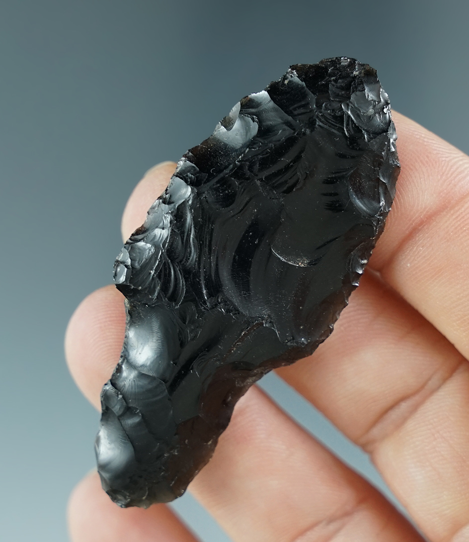 2 5/16" obsidian Lind Coolee found in southern Oregon. Pictured in Overstreet #9, page 1039