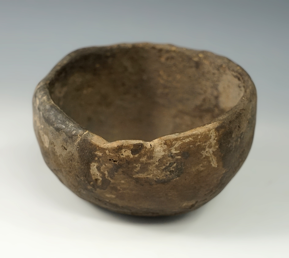 3 3/4" wide pottery vessel recovered from a rock shelter in McCreary County Kentucky.