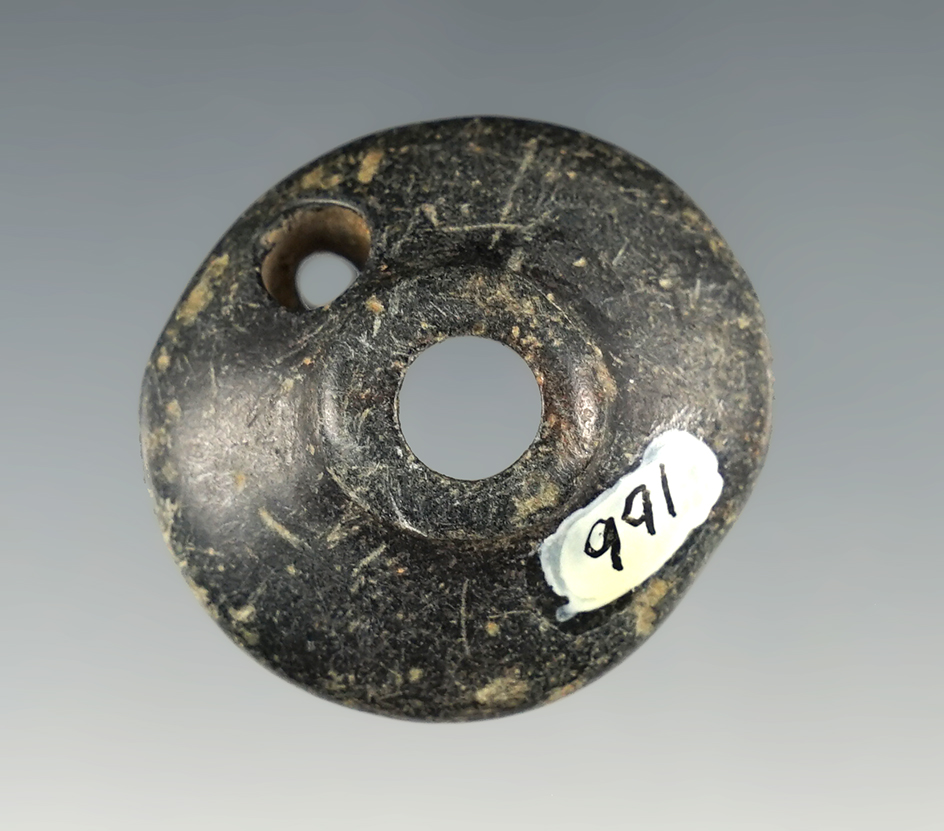 1 1/4" anciently salvaged steatite pipe section with a suspension hole. Obie Site, Klickitat Co., WA