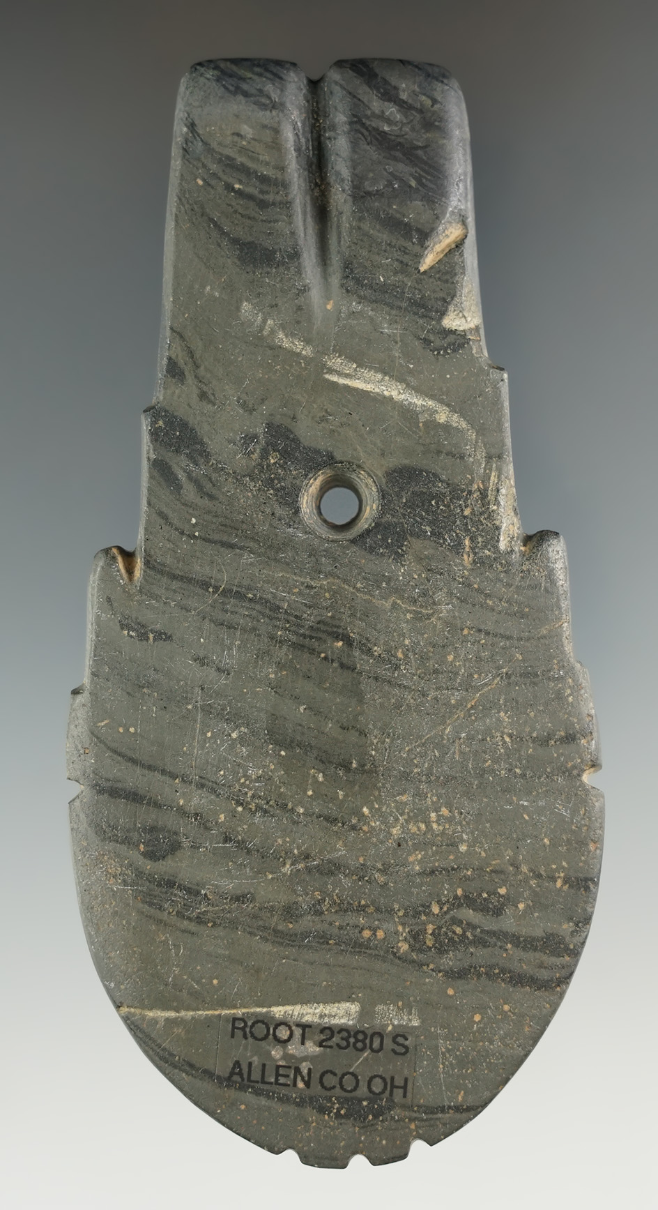 Highly stylized 4 1/16" Hopewell Shovel Pendant that is fringed and indented.  Restoration to 1/2 "