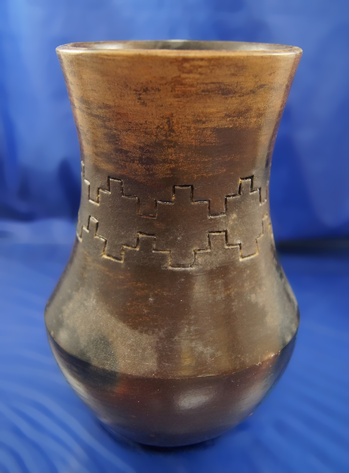 7 1/4" tall nicely style pottery vessel that is signed by Susie Williams, Navajo.
