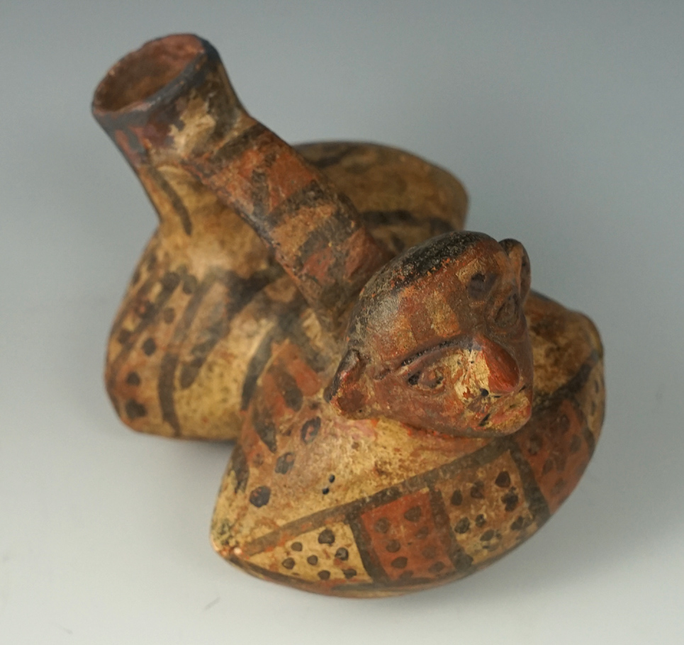 Rare style 3 5/8" wide dual chamber pre-Columbian stirrup handle pottery vessel. Peru.