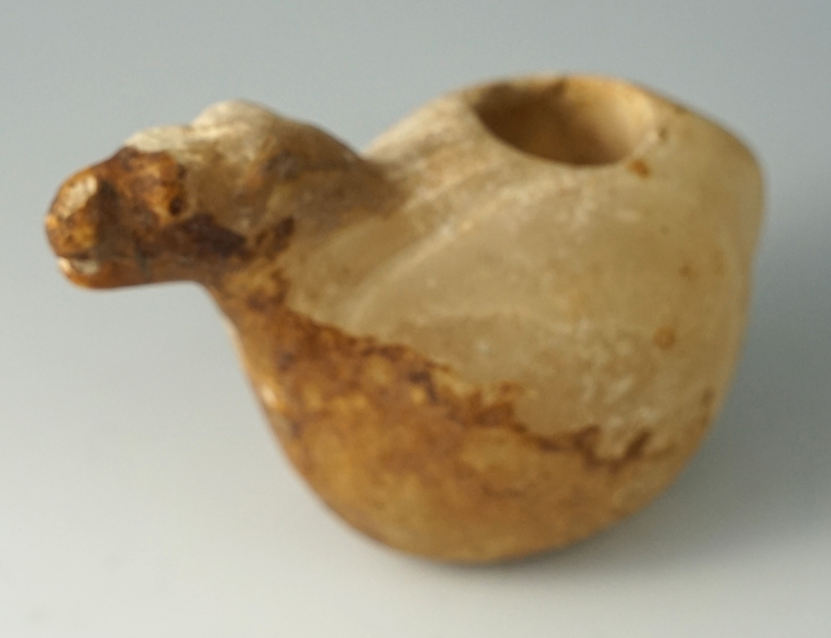 3 3/8" Heavily patinated llama Canopa found in Peru. Made from semi translucent material.