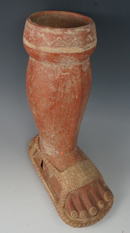 Excellent craftsmanship on this 8 1/2" Moche culture Leg Pot with ornate sandal detail.  Peru.