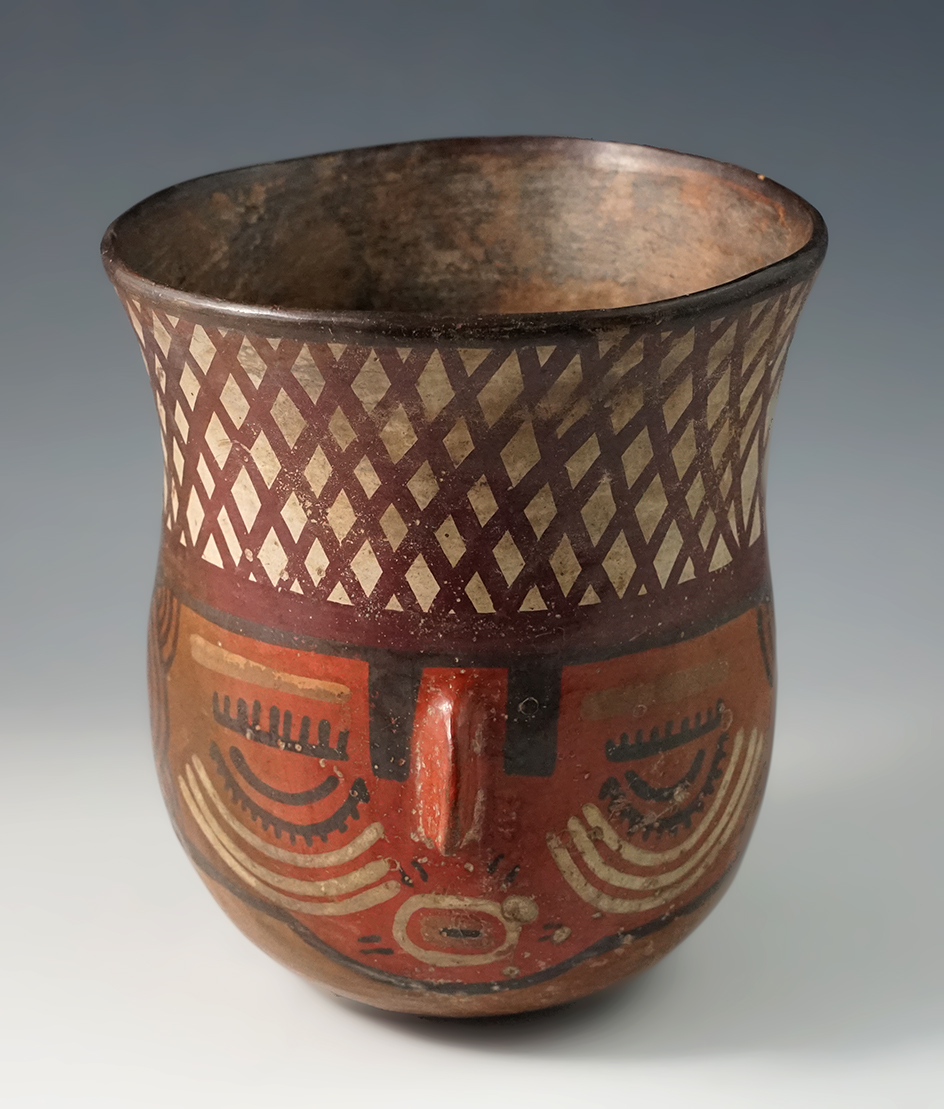 5 1/2" Beautifully painted Nazca Polychrome Face Effigy Vessel found in Peru. Circa A.D. 200-400.