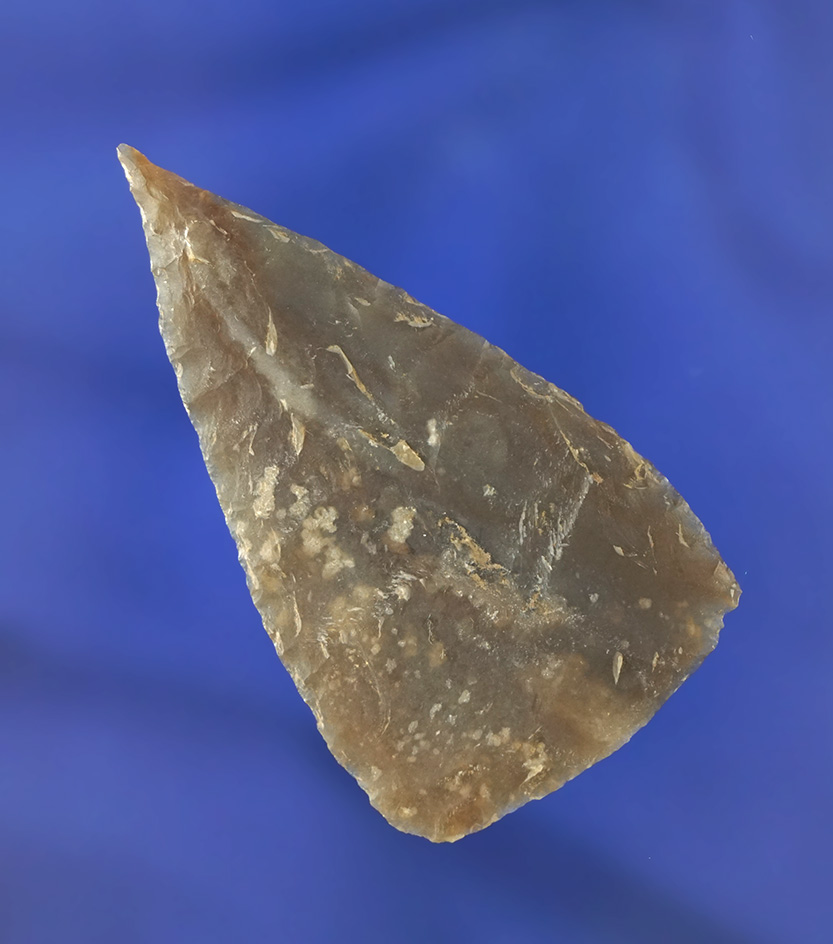 Exceptional flaking on this 2 9/16" Flint Blade with a needle tip that is semi translucent - Texas.