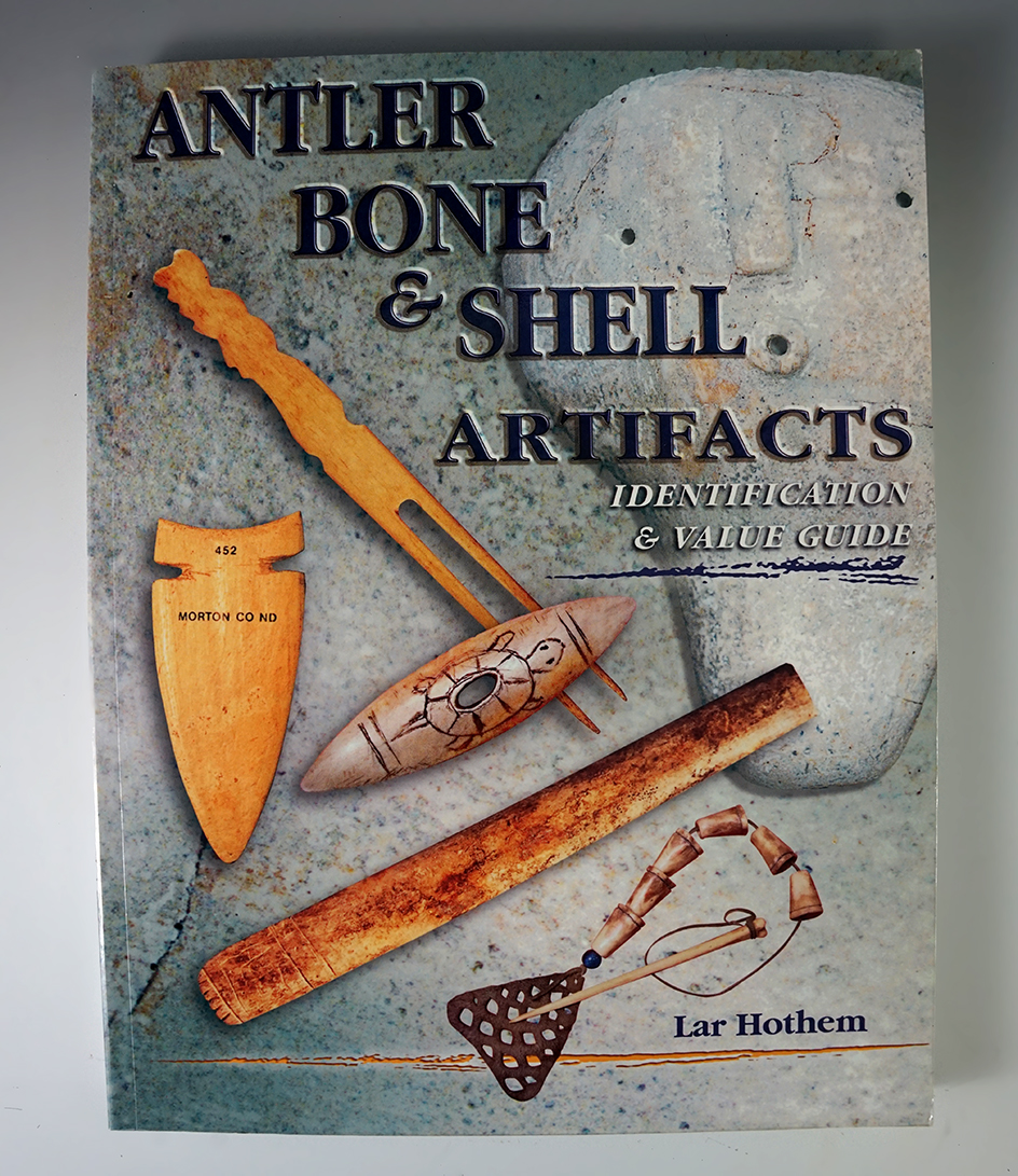 Softcover book: "Antler, Bone, & Shell Artifacts Identification & Value Guide" by Lar Hothem, 2006.