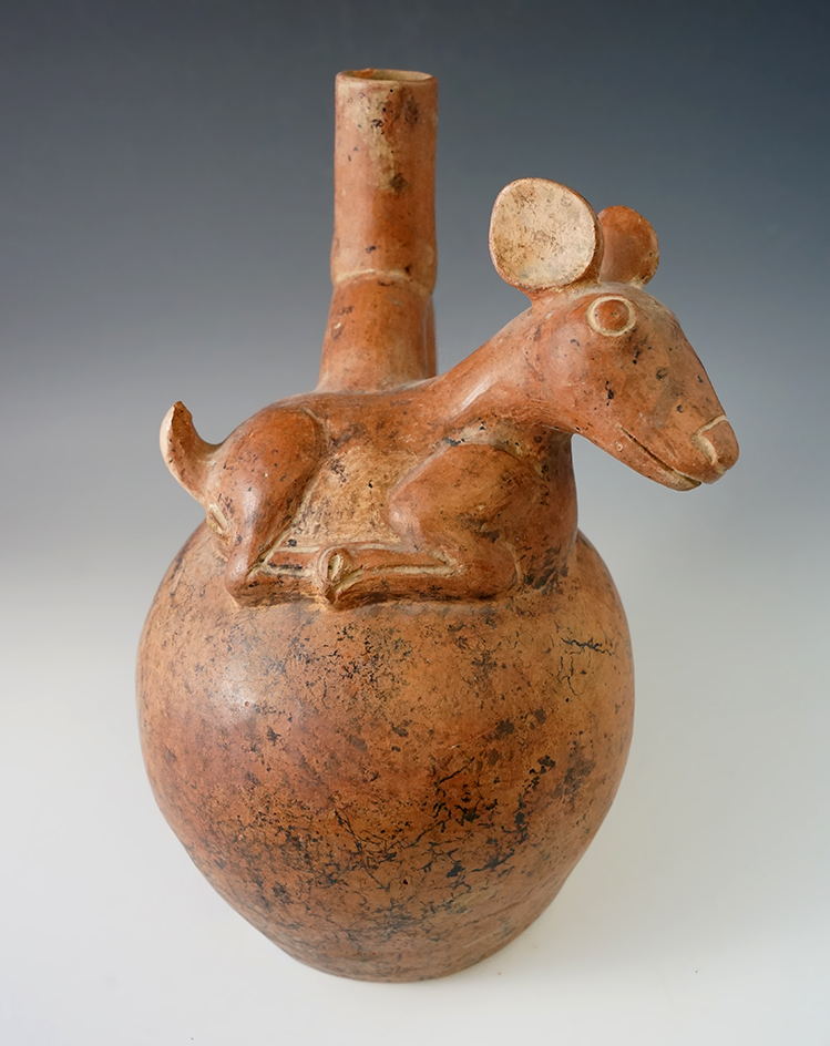 9 1/4" Tall Deer Effigy Stirrup Bottle. Peru - one area of surface delamination and small hole on ba