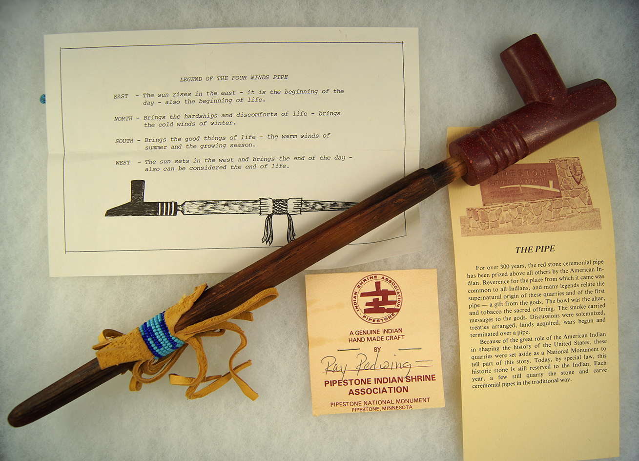 Nicely styled contemporary Catlinite pipe with a wood stem made by Ray Redwing