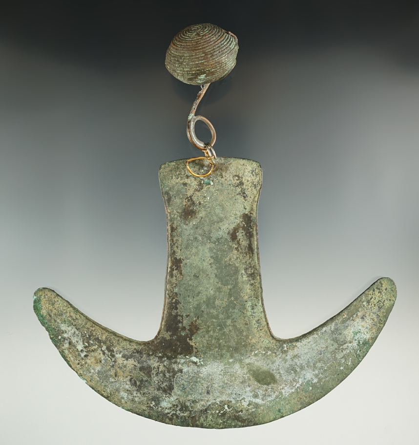 Pair of Pre-Columbian copper artifacts including a 5 3/4" wide copper Tumi and ornate copper bell.