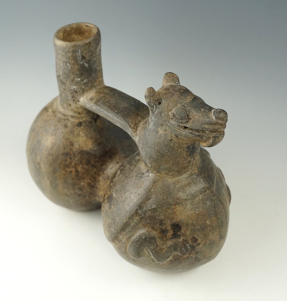 Intact Chimu Culture compound bottle with a bat effigy that measures 7" long. Found in Peru.