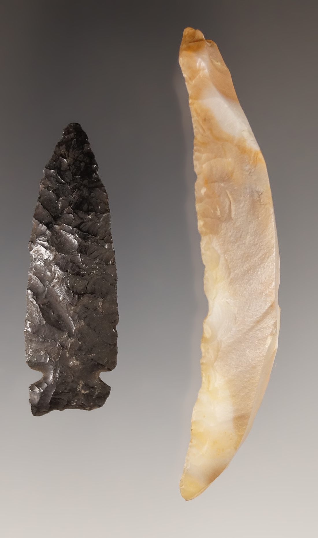 Pair of artifacts found in Oregon near the Columbia River. One is a 2 15/16" agate Paleo Uniface
