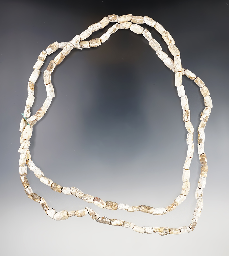 32" long strand of drilled shell beads that are heavily patinated found in Virginia.