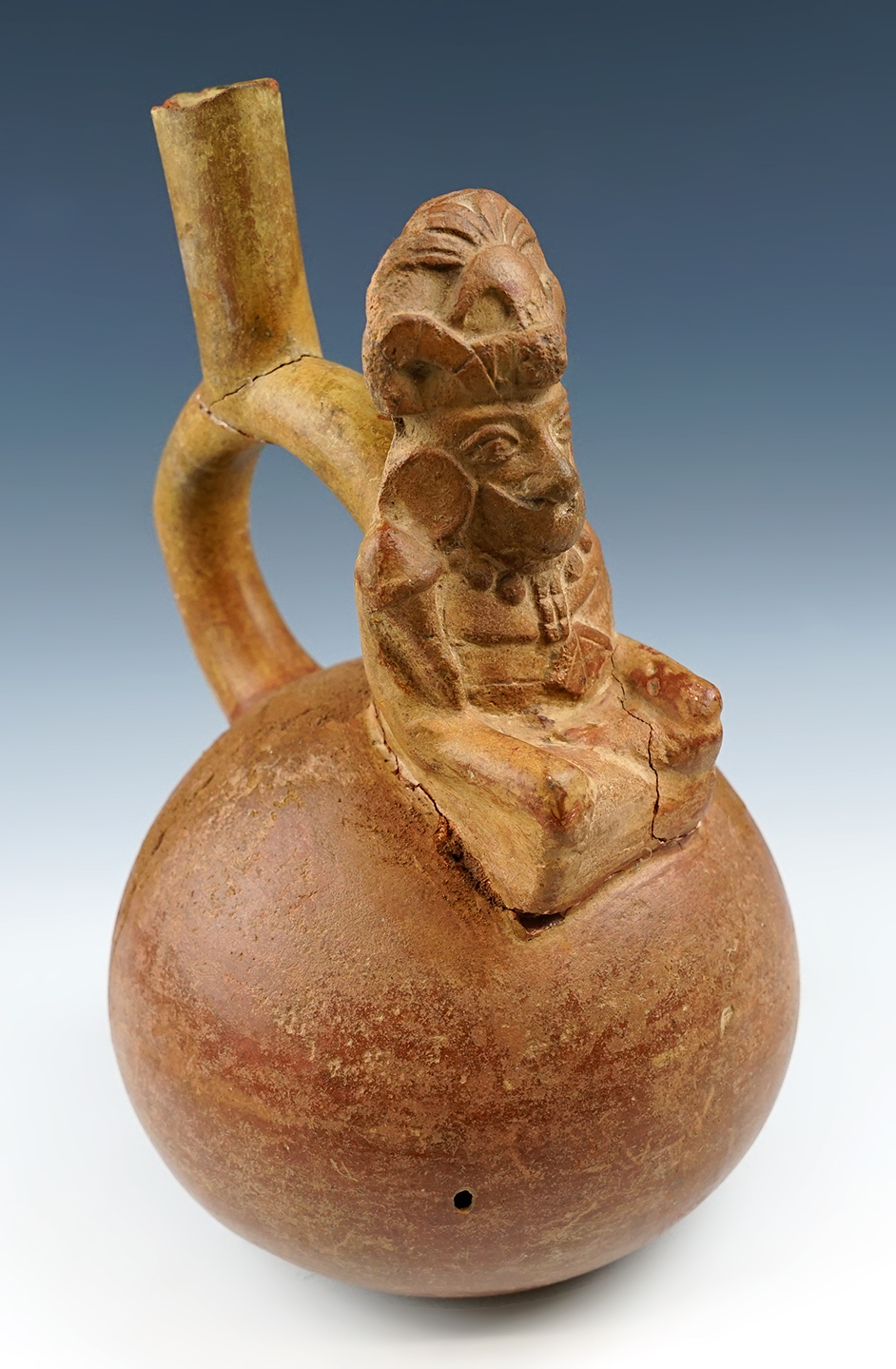 10" tall x 5 3/4" wide Moche stirrup pot with a high status figure motif - Peru.