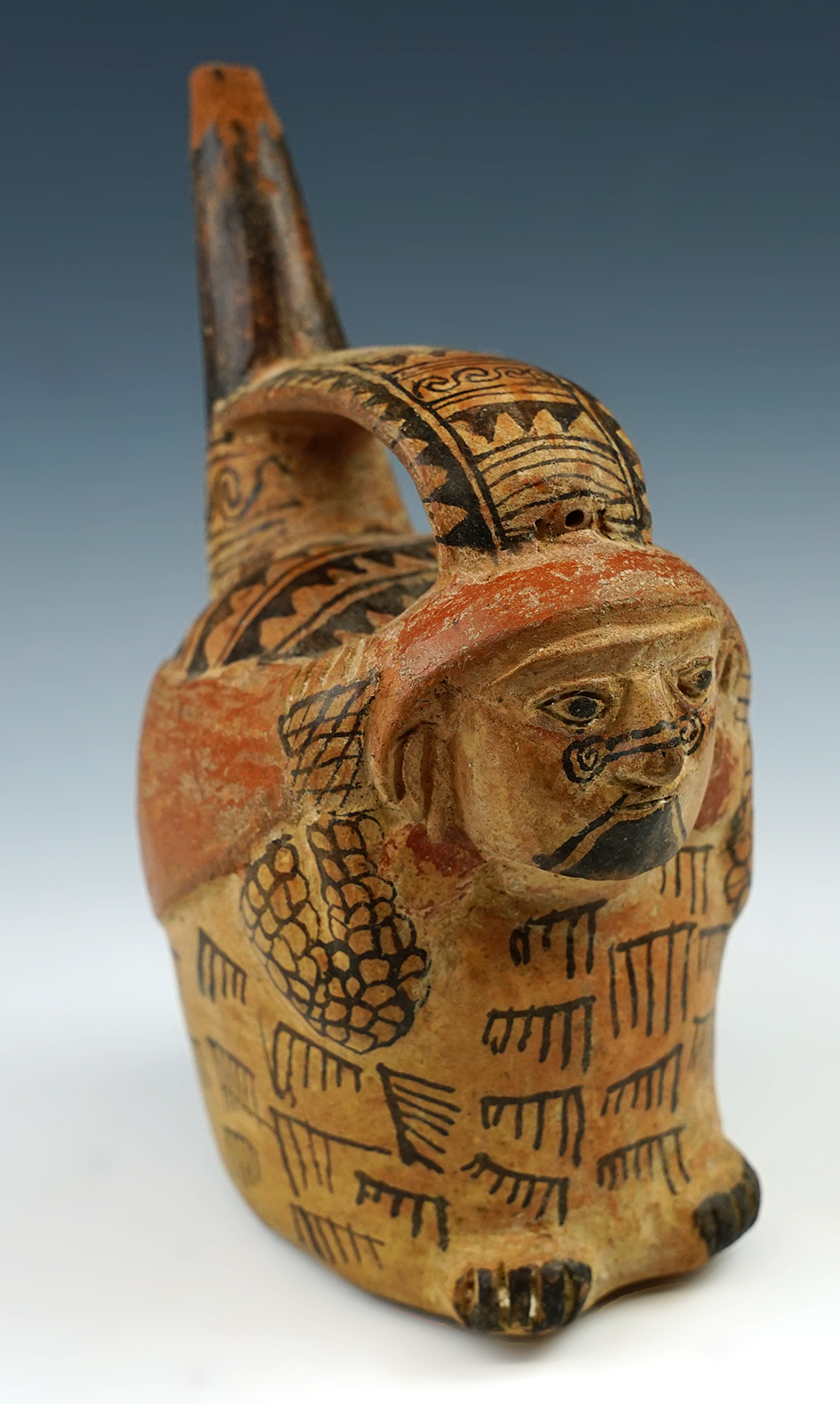 7" tall x 5 1/4" wide Lambayeque stirrup pottery vessel with excellent exterior paint - Peru.