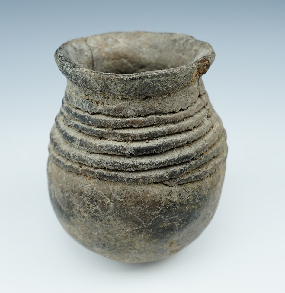 3 11/16" tall Pottery Jar found in New Mexico. Has a few cracks but overall nice.