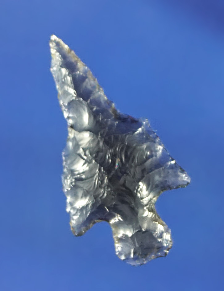 Very unique style on this 1" highly translucent obsidian arrowhead found in Oregon.
