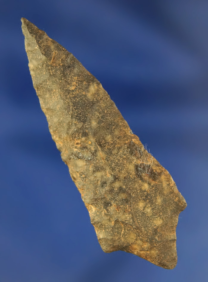 Heavily patinated 2 5/16" Stemmed Dart Point, found location unknown.