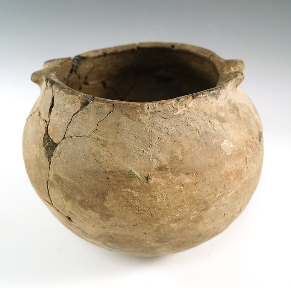 4 1/2" tall by 5 1/2" wide pottery vessel that has been glued back together found in Hickman, KY.