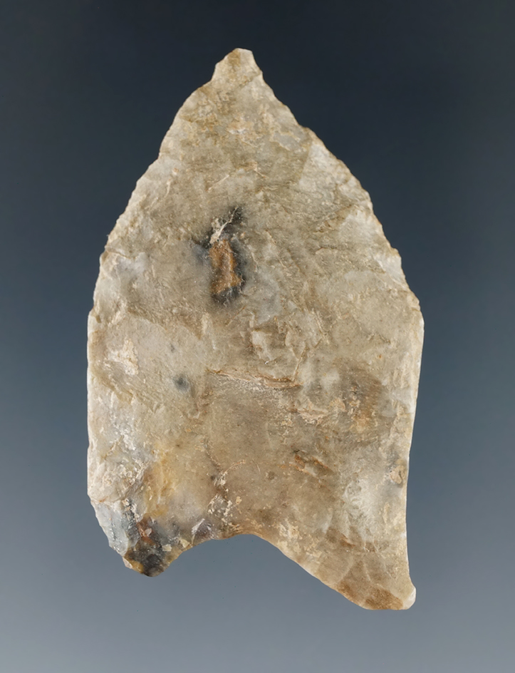 Heavily patinated Fluted Paleo Point with heavily ground lower edges found in Illinois.