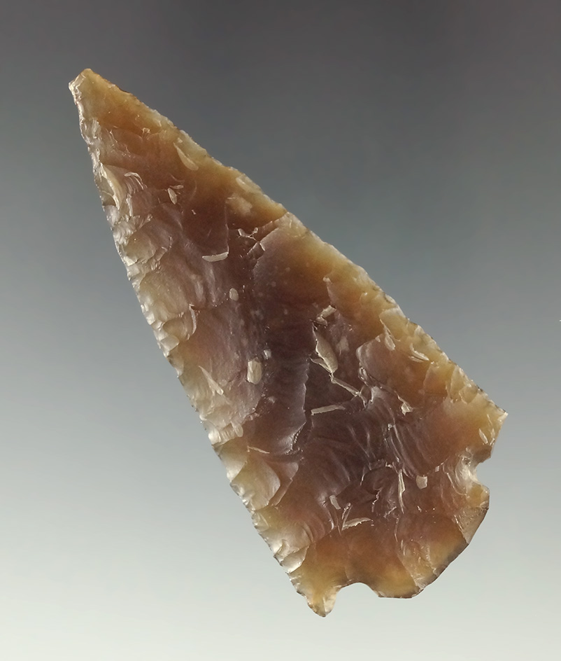 2 1/2" nicely translucent Knife River Flint Cornernotch with a snapped base.