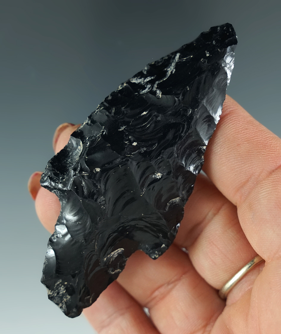 3 1/16" Archaic stem knife with a nicely ground stem and steeply beveled edges. Lake Co., Oregon.