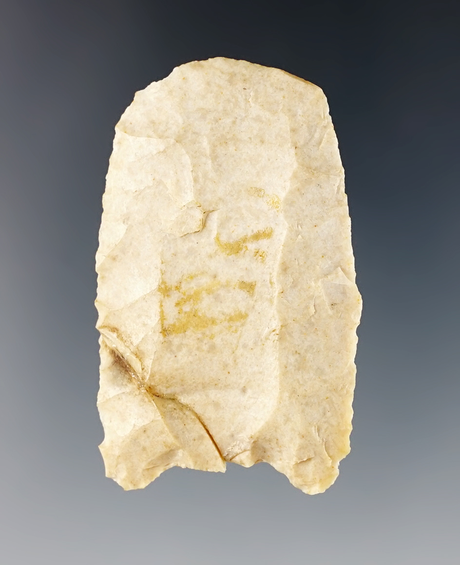 1 15/16" Paleo Clovis that was anciently worked into a Hafted Scraper. Broken and glued.