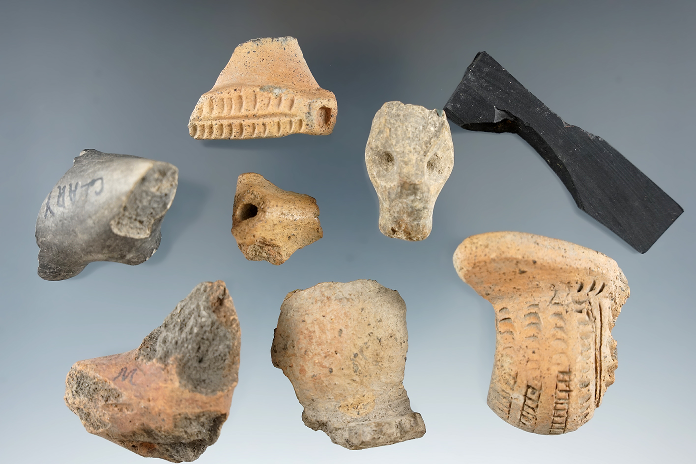 Set of seven assorted pottery fragments found in New York.