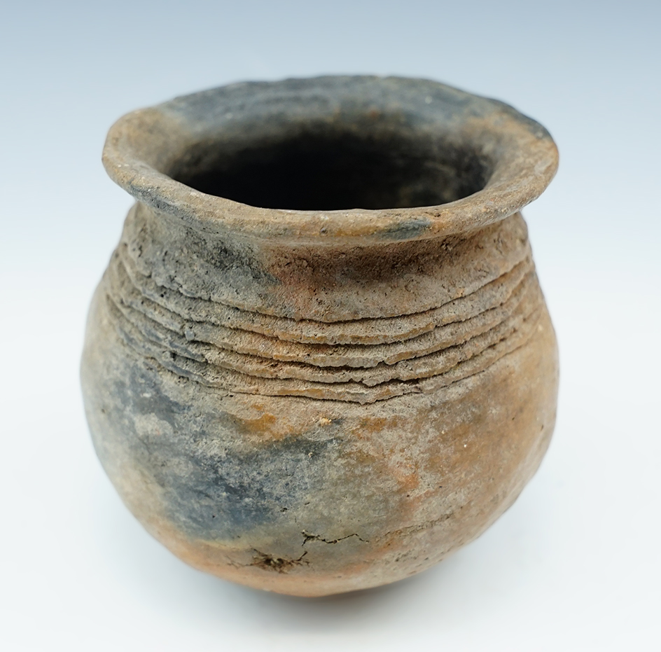 Miniature 2 1/2" tall  Prehistoric pottery jar recovered in New Mexico in solid condition.