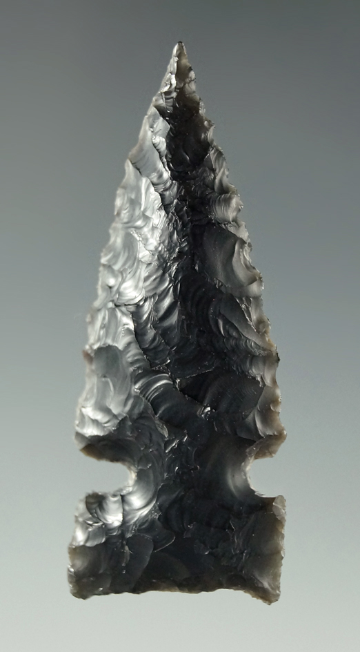 Nice! Heavily patinated 2 3/16" obsidian Northern Side Notch found in the Great Basin area.  COA.