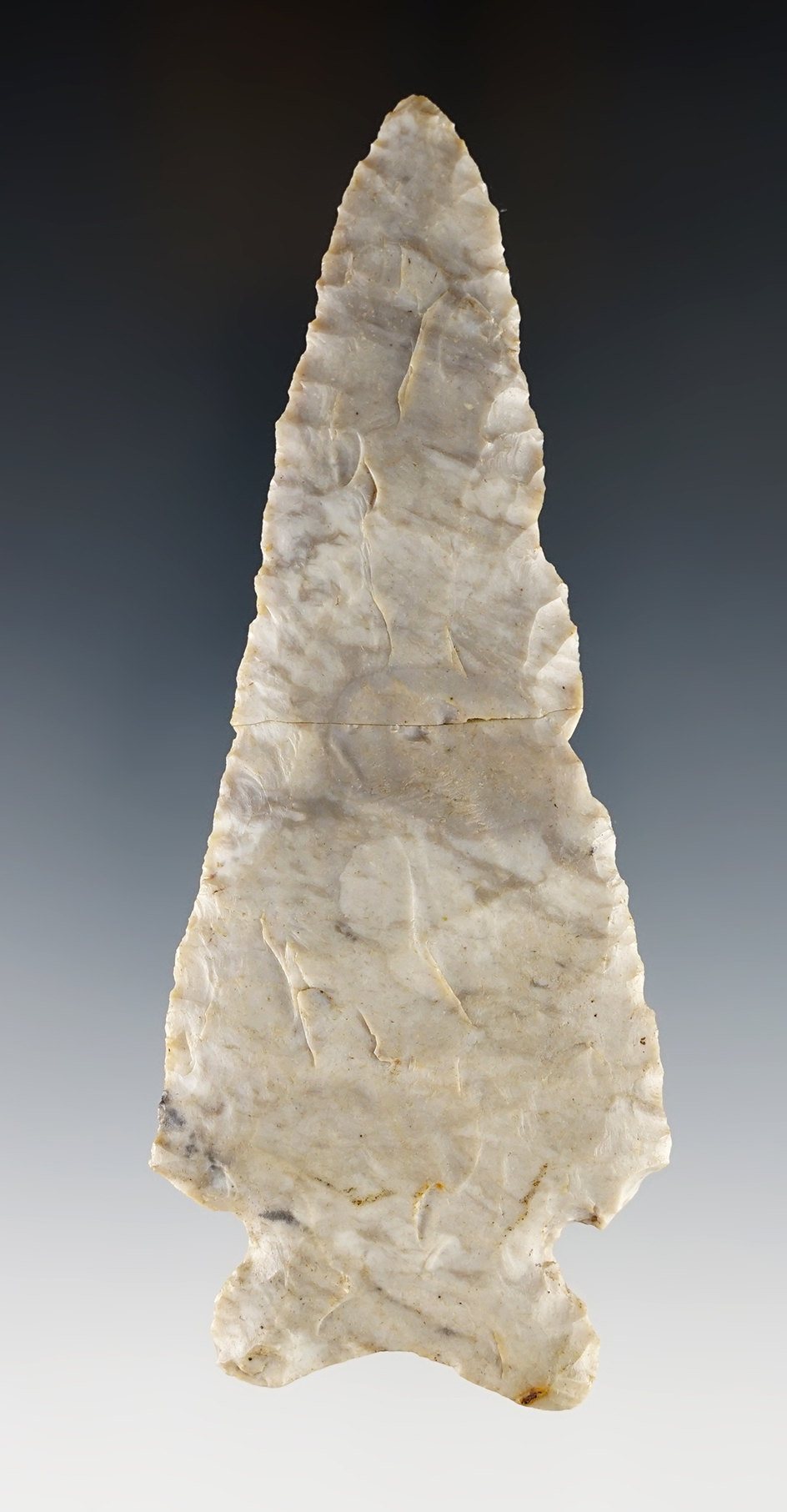 4 3/4" Archaic Cornernotch that is broken and glued. Found in Madison Co., Ohio. Ex. Bill Likens.