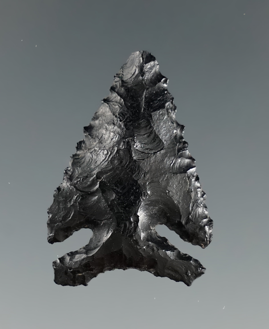 Nice basal style on this 1 3/16" Piquin point made from obsidian found in Oregon. Ex. Jim Hogue.