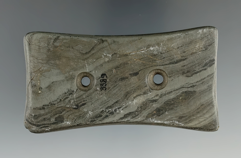 3 11/16" Adena Quadriconcave Gorget that is made from Mottled Slate tallied on three sides. Ohio.