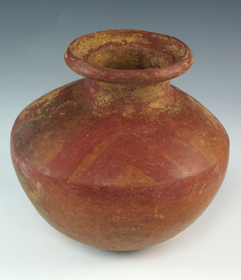 Pre Columbian red on buff solid bottle with raised ring on top and a carinated body. Measures 7"