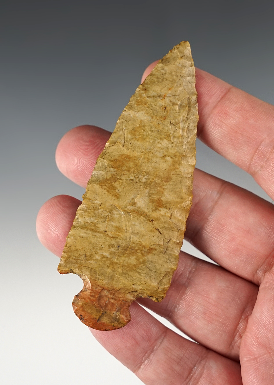 3 1/2" Stemmed Point found in Tennessee that is nicely patinated. The base bottom is heavily ground.