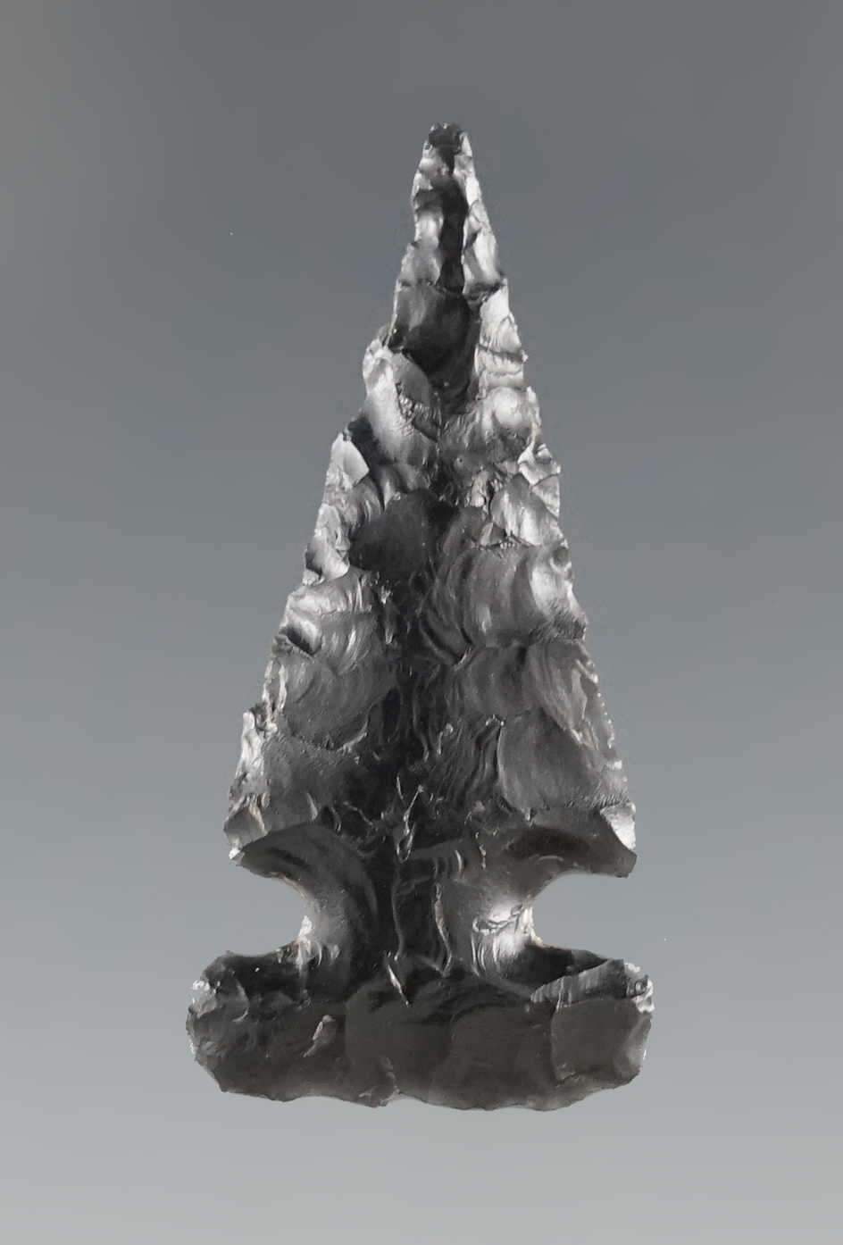 1 5/16" obsidian Sidenotch point that is nicely made found near the Columbia River, Oregon.