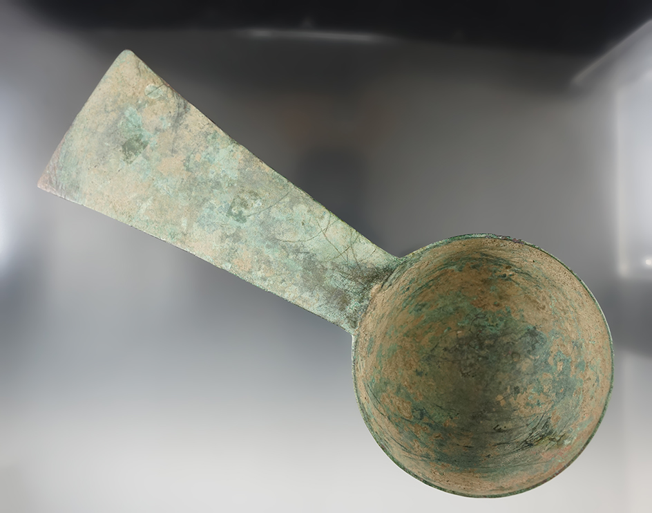 Beautifully styled pre-Columbian 9" copper ladle found in Peru in excellent condition.