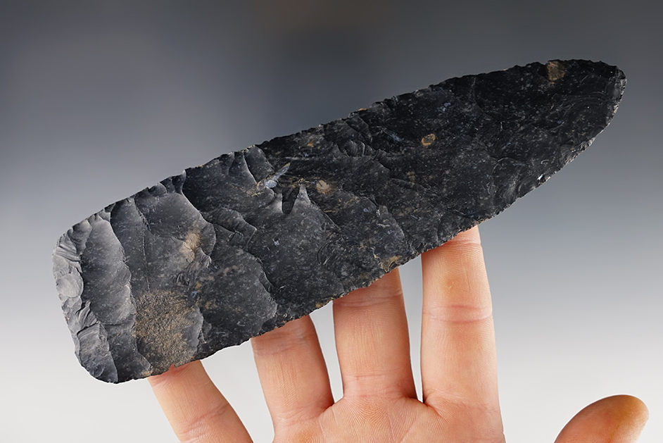 Large and well flaked 6 5/8" Cache Blade that is broken and glued about 1" up from the base. 