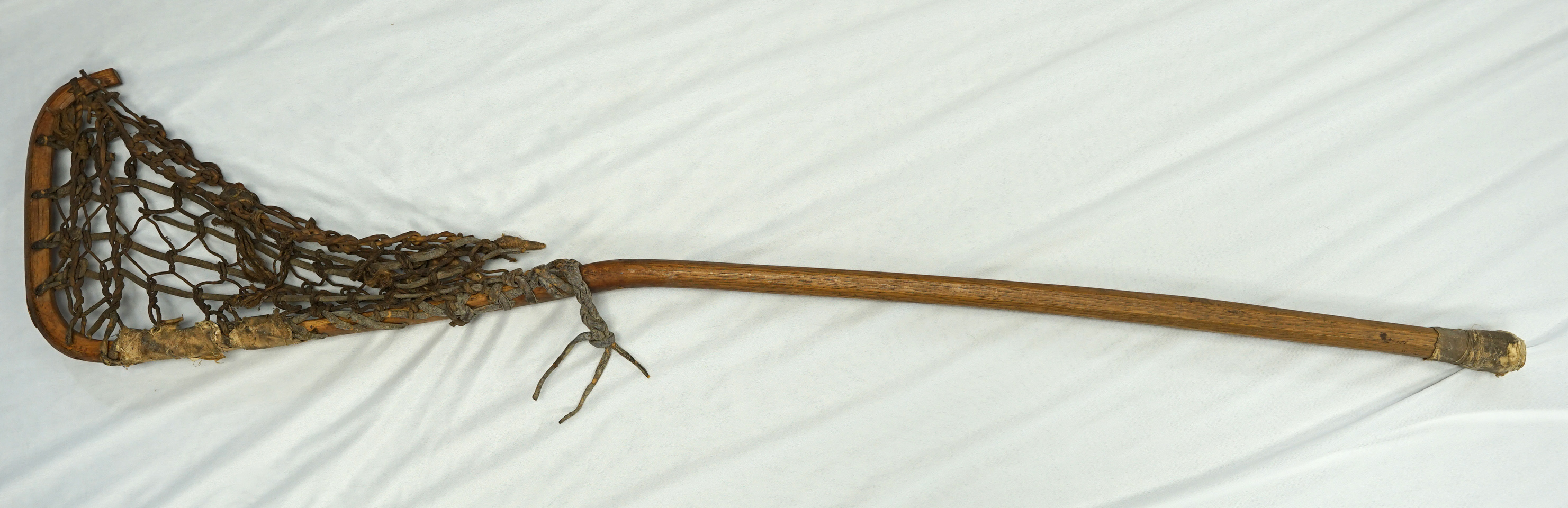 45" vintage Iroquois LaCrosse Stick made from wood and leather from New York.