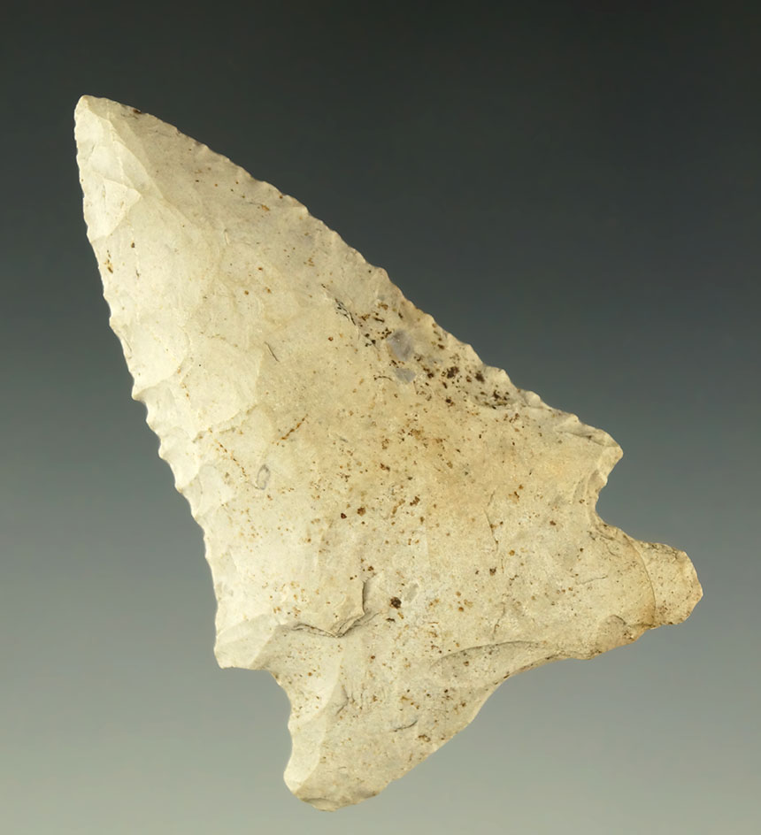 2 9/16" cornernotch point found in Missouri that is heavily patinated with good mineral deposits.