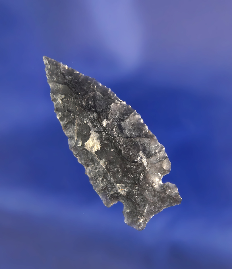 Sidenotch that is nicely flaked from heavily patinated Obsidian, 1 3/4" long  found near Fort Rock,
