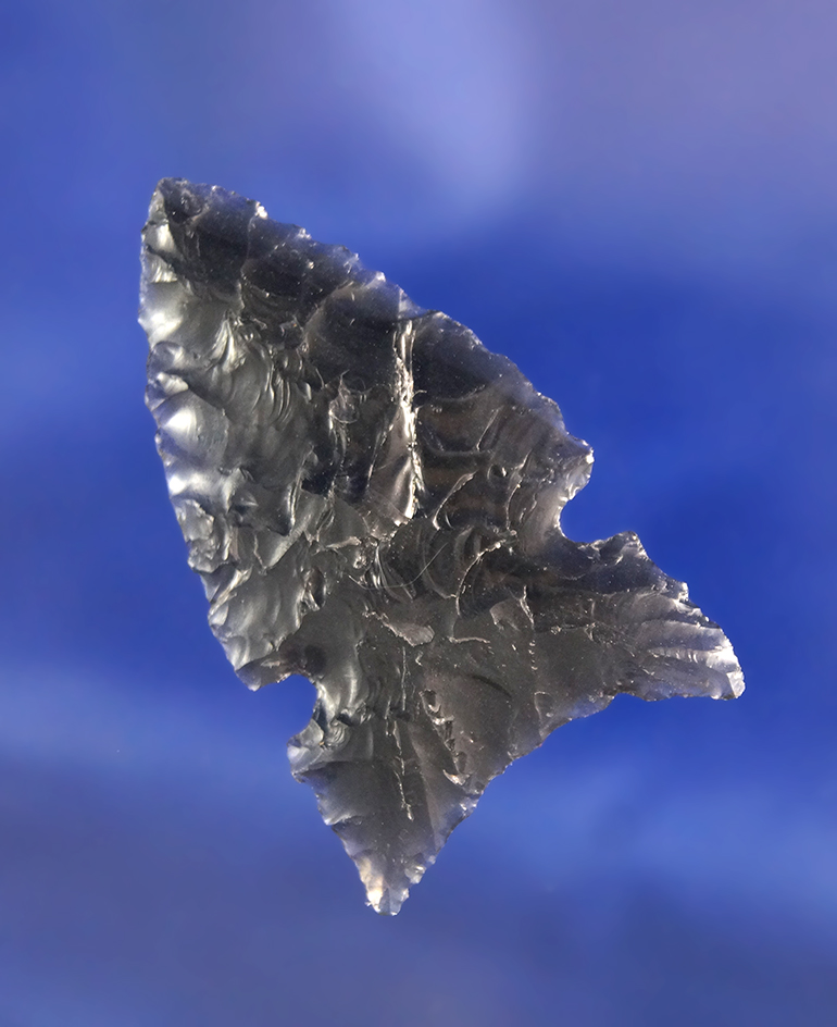 1 3/4" Northern Side Notch that is thin, well flaked and nicely styled. Made from Obsidian, Oregon.