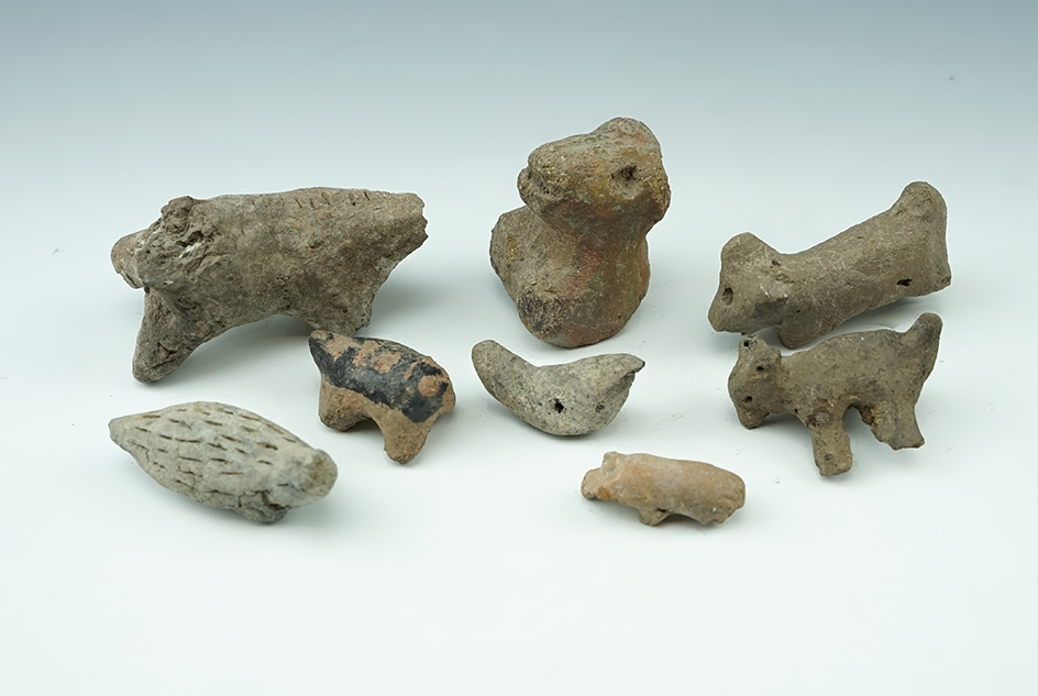 Set of 8 New Mexico Pottery Effigies that are well patinated. The largest is 2 7/8".