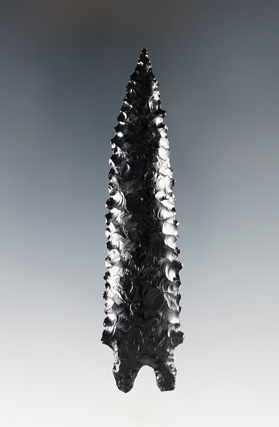 Amazing flaking and style on this 3 5/16" Gatecliff split stem - Nevada. Stermer COA.